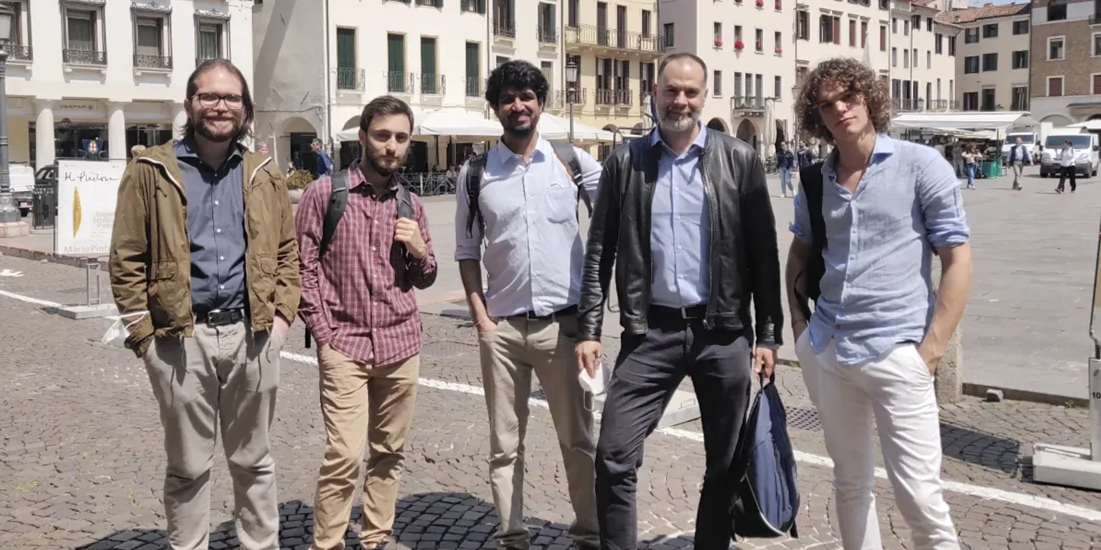 Jay with members of Dr. Riccardo Ciolfi’s research group in a square in Padova